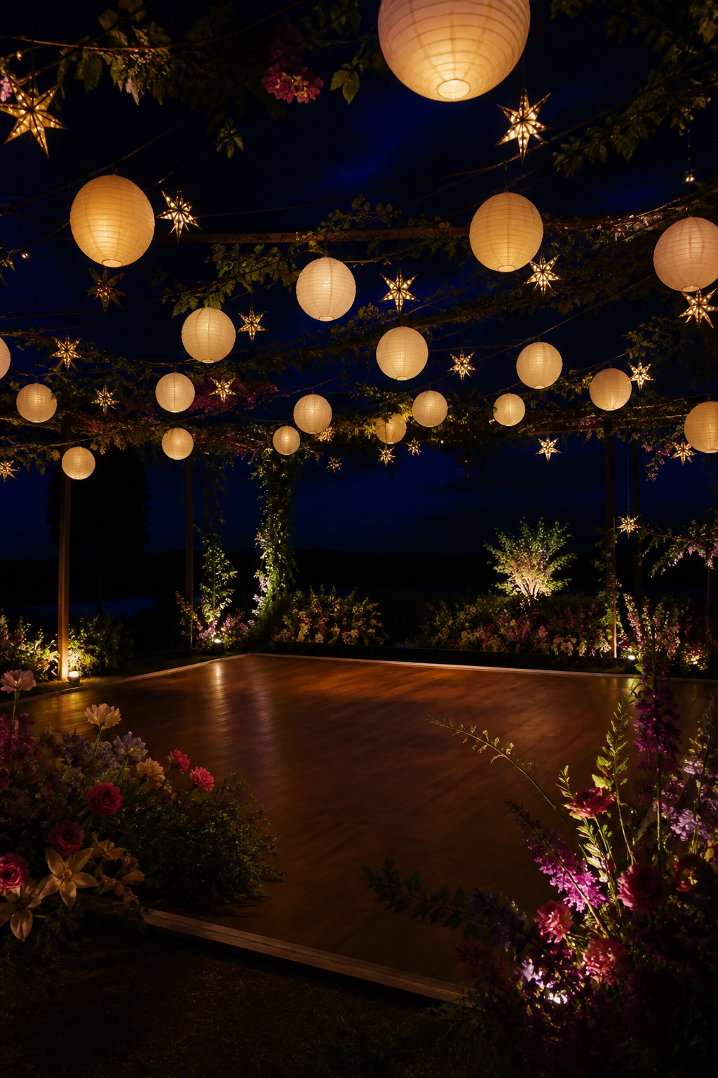 A glowing outdoor dance floor under paper lanterns at night